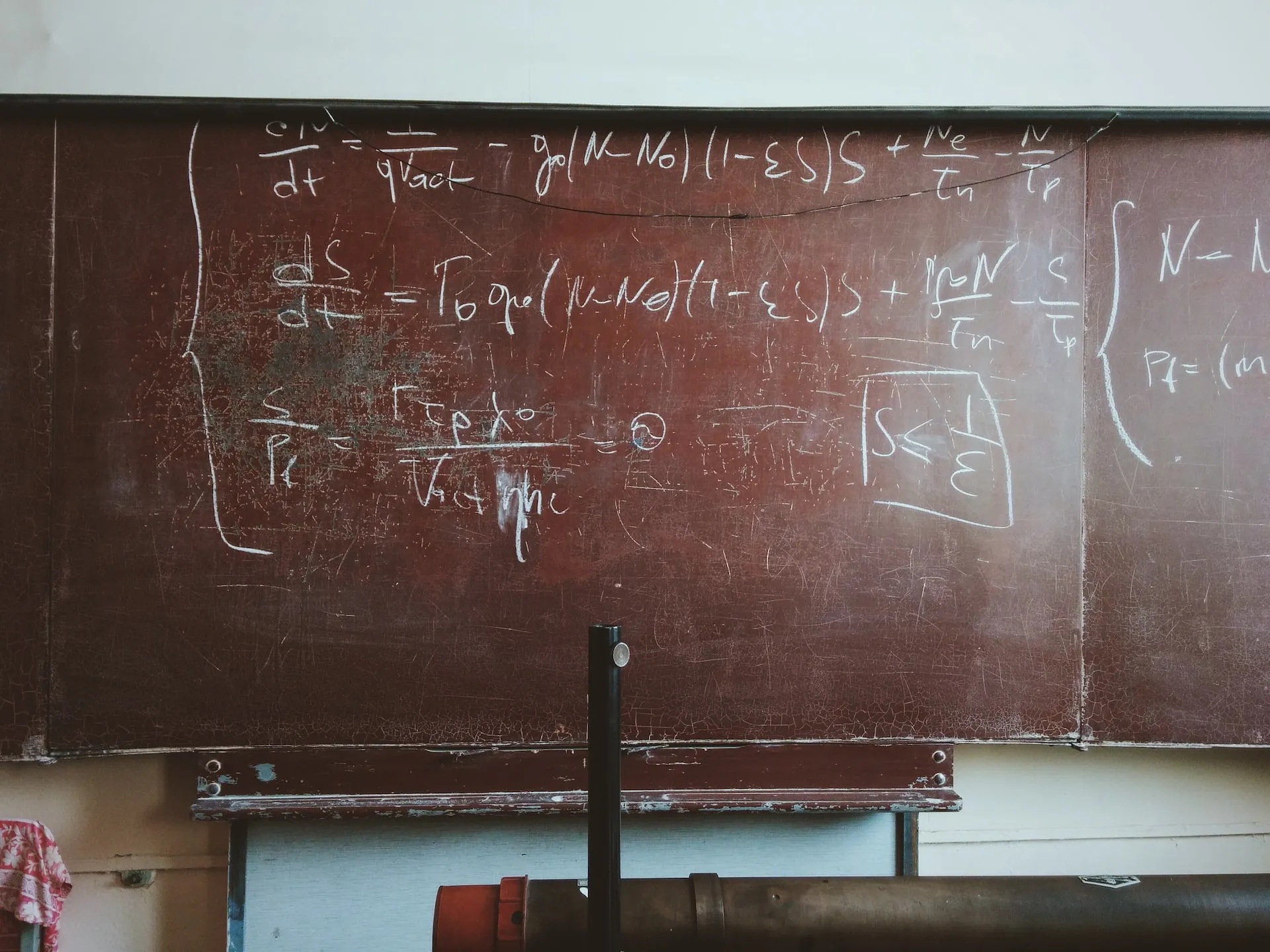 Chalkboard with some maths scribblings