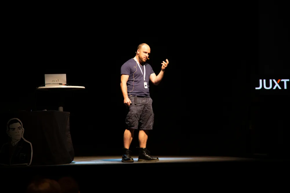 Jon giving a talk on stage