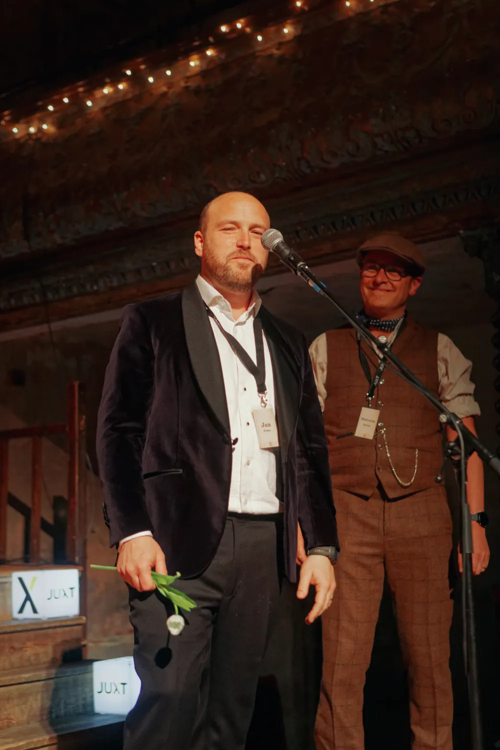 Jon on stage with Malcolm at the 10 year party