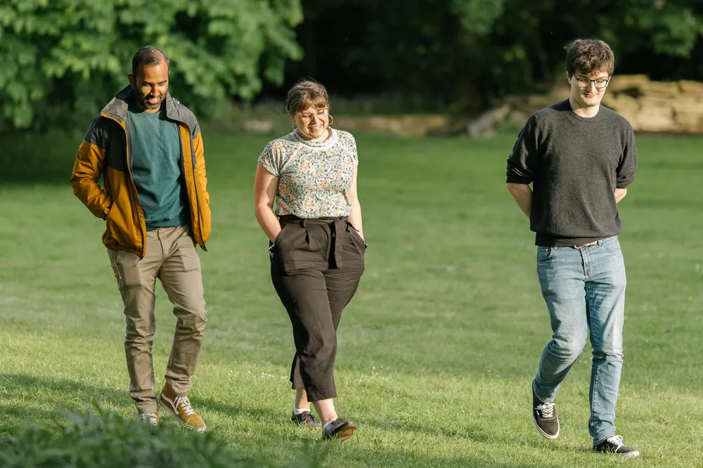 Three JUXT employees walking together